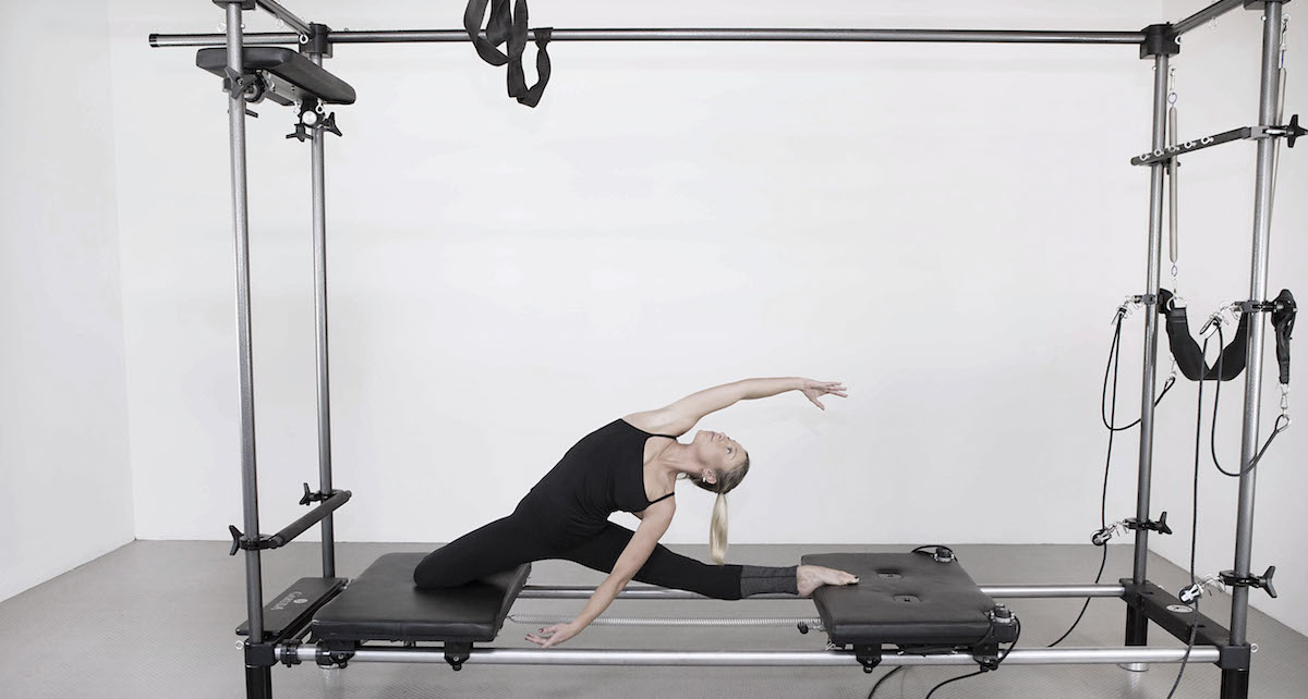 A student at Anna Tetlow Pilates practicing Garuda. Photo courtesy of Tetlow.