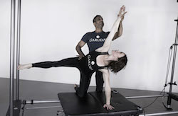 Anna Tetlow practicing Garuda with James D'Silva. Photo courtesy of Tetlow.