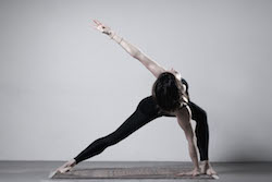 Anna Tetlow of Anna Tetlow Pilates practicing Garuda. Photo courtesy of Tetlow.