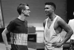 Callum Mansfield giving direction to Barry Conrad (Kenickie) in rehearsals. Photo by Nick Morrissey Photography