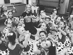 Jess Solomon, principal of Backstage Dance Academy, with students. Photo courtesy of Solomon.